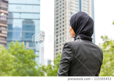 Professional Muslim Woman in City Business District Professional Muslim Woman in City Business District 115305453