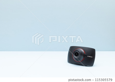 Mockup Car and Driver Road Patrol Touch Dash Camon Blue Background. Copy Space for Text. Blindspot Car Camera for Vehicle. Safe Driving. Horizontal Plane. Mockup Car and Driver Road Patrol Touch Dash Camon Blue Background. Copy Space for Text. Blindspot Car Camera for Vehicle. Safe Driving. Horizontal Plane. 115305579