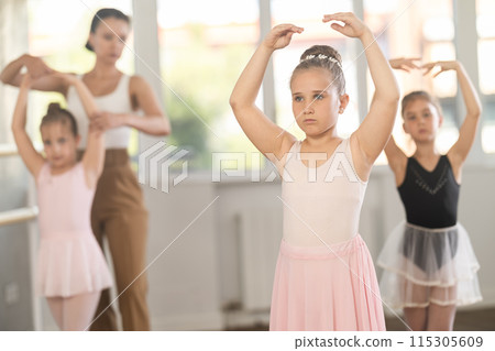 Group of girls stand in fifth position Group of girls stand in fifth position 115305609