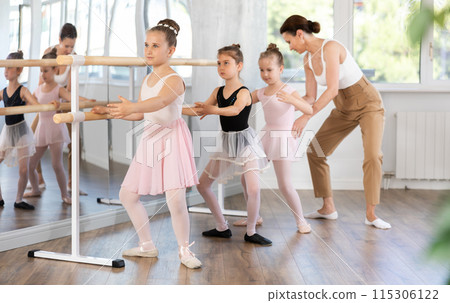 Lesson for little ballerinas - girls learn to dance ballet in choreographic class 115306122