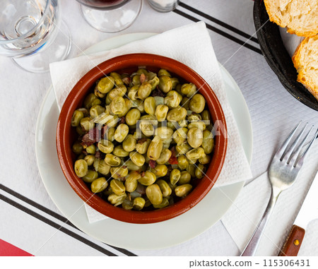 Delicious habas con jamon served on plate 115306431