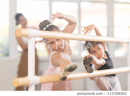 Girls dancers doing stretching at barre 115306802