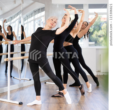 Girls in ballet class perform Batman with participation of mature female mentor 115306821