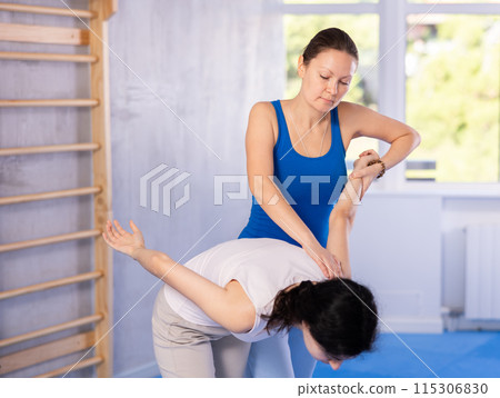 women perform elbow blow 115306830