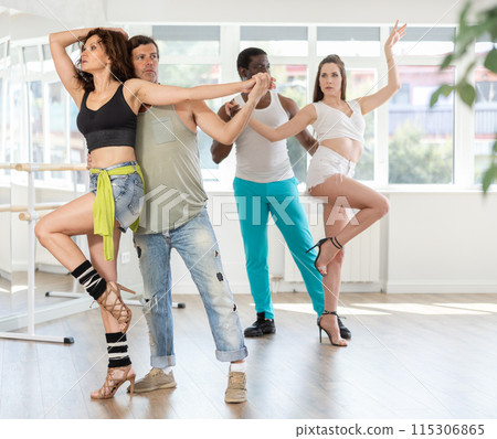 Adult couple enjoying impassioned kizomba in latin dance class 115306865