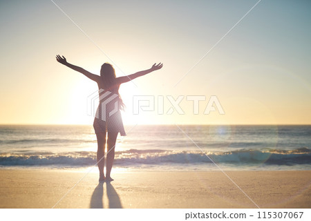 Woman, hands up and goal with silhouette at beach with sunset sky, mock up space and celebration. Girl, person and success with cheers, stretching and summer sunshine at dusk with winning by ocean Woman, hands up and goal with silhouette at beach with sunset sky, mock up space and celebration. Girl, person and success with cheers, stretching and summer sunshine at dusk with winning by ocean 115307067