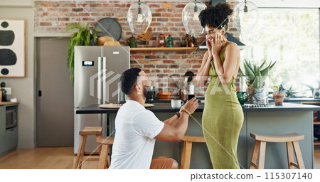 Couple, proposal and surprise with engagement in home for commitment, marriage promise or ring box on knee. People, question and romantic gesture in kitchen of house with love, future together or yes 115307140