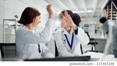 Women, high five and laptop in lab for science, notification or celebration for research project. People, scientist and lab partner by computer for cheers, excited or results for funding application 115307286