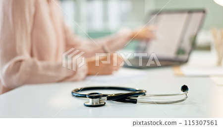Healthcare, table and closeup of stethoscope in hospital for cardiology, lungs examination and breathing test. Medicine, medical tool and listening equipment on office desk in clinic for heart health 115307561