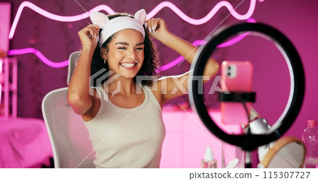 Woman, content creator and ring light for streaming, webcam and beauty for influencer person in home. Tutorial, talking and cellphone for followers on social media, cosmetics and vlog for recording Woman, content creator and ring light for streaming, webcam and beauty for influencer person in home. Tutorial, talking and cellphone for followers on social media, cosmetics and vlog for recording 115307727
