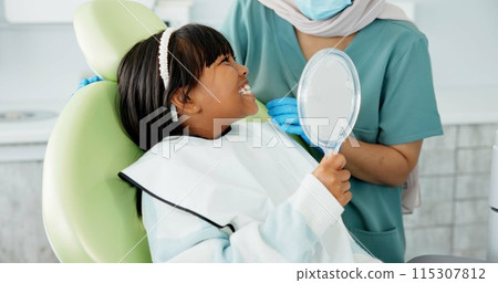 Dentist, woman and kid with mirror for dental health, results and teeth cleaning service with medical advice or support. Orthodontist or doctor talking to child or excited girl of tooth procedure Dentist, woman and kid with mirror for dental health, results and teeth cleaning service with medical advice or support. Orthodontist or doctor talking to child or excited girl of tooth procedure 115307812