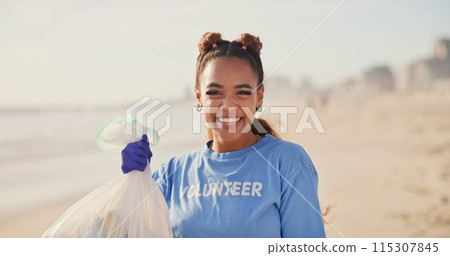 Woman, volunteer and face on beach with plastic bag for cleaning garbage, community service or sustainability. Female person, smile and trash recycling for climate change, planet or waste management Woman, volunteer and face on beach with plastic bag for cleaning garbage, community service or sustainability. Female person, smile and trash recycling for climate change, planet or waste management 115307845