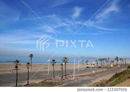 Beach, Pacific ocean, park, parking lot, and restroom buildings in the early morning 115307930