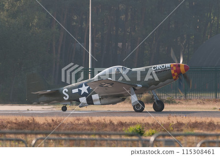 A US military P-51D Mustang fighter jet takes off. A US military P-51D Mustang fighter jet takes off. 115308461