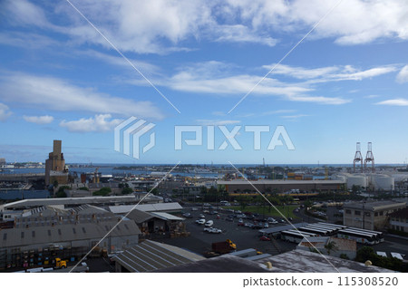 Aerial view of the Honolulu Port with landmarks Nimitz Highway, cargo cranes and Sand Island Aerial view of the Honolulu Port with landmarks Nimitz Highway, cargo cranes and Sand Island 115308520