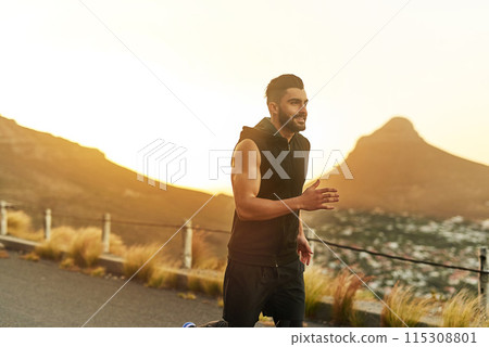 Sunset, man and running with smile in countryside for fitness and exercise in summer. Mountain, athlete and training for marathon in nature for wellness and workout with happiness or pride in France 115308801