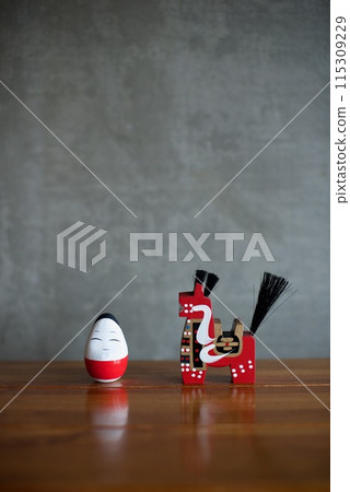 Folk crafts lined up on a table 115309229