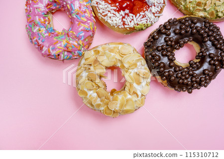 Various delicious donuts with different sprinkled decorations Various delicious donuts with different sprinkled decorations 115310712