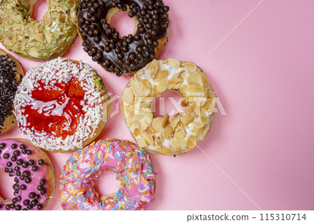 Various delicious donuts with different sprinkled decorations Various delicious donuts with different sprinkled decorations 115310714
