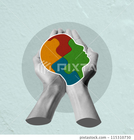 A human hand showing a jigsaw puzzle of a human head 115310730