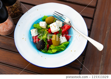 Traditional greek vegetable salad with cheese feta and olives Traditional greek vegetable salad with cheese feta and olives 115311029