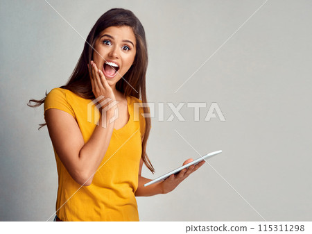 Woman, portrait and surprised with tablet in studio background on internet for online sale and announcement. Female person, happy and mockup space with wow or notification and offer for discount Woman, portrait and surprised with tablet in studio background on internet for online sale and announcement. Female person, happy and mockup space with wow or notification and offer for discount 115311298
