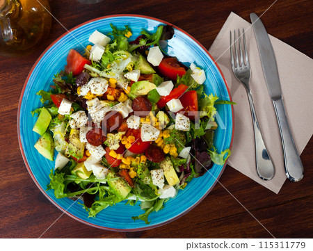 Fresh vegetable salad with mozzarella and sausages Fresh vegetable salad with mozzarella and sausages 115311779
