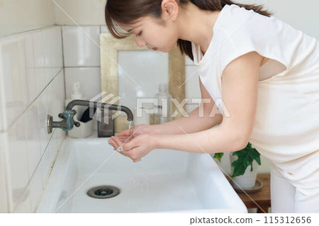 Young woman doing morning routine Young woman doing morning routine 115312656