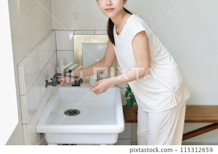 Young woman doing morning routine Young woman doing morning routine 115312659