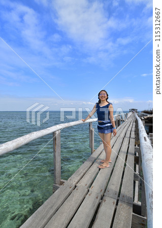 Japanese girl enjoying island hopping (Nalusuan Island, Cebu, Philippines) Japanese girl enjoying island hopping (Nalusuan Island, Cebu, Philippines) 115312667