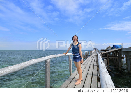 Japanese girl enjoying island hopping (Nalusuan Island, Cebu, Philippines) Japanese girl enjoying island hopping (Nalusuan Island, Cebu, Philippines) 115312668