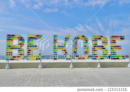 A view of the beach and ocean through the BE KOBE monument at Suma Seaside Park, Suma Ward, Kobe City, Hyogo Prefecture 115313158