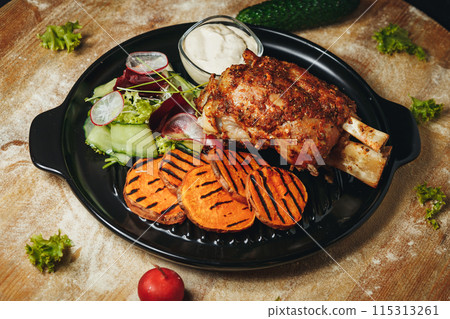 Rustic Dinner Delight, A beautifully arranged plate of meat and vegetables 115313261