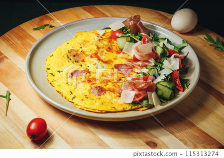 Delectable Omelet Affair , A colorful omelet with a medley of vegetables Delectable Omelet Affair , A colorful omelet with a medley of vegetables 115313274
