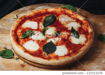 Savory Delight: Pizza With Mozzarella and Basil 115313276