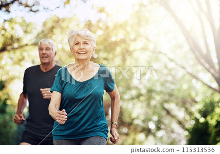 Running, outdoor and old couple with sunshine, smile and wellness with challenge, healthy and hobby. Park, senior man and mature woman with training, retirement and exercise with fitness and cardio 115313536