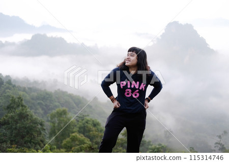 Asian woman freedom journey with valley mountain and foggy in natural and travel destination in tropical rain forest Asian woman freedom journey with valley mountain and foggy in natural and travel destination in tropical rain forest 115314746