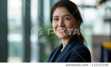 Professional Latina Businesswoman Smiling Confidently in Modern Office Setting, Diversity, Corporate Success, Concept: Business Leadership, Multicultural Workplace 115315336