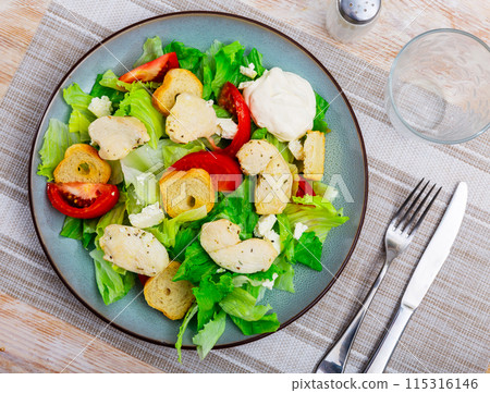 Portion of fresh Caesar salad with tomatoes Portion of fresh Caesar salad with tomatoes 115316146