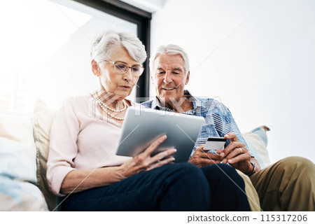 Senior couple, tablet and credit card with browsing in house for online shopping with people. Finance, retirement and discount with internet banking, transaction and digital purchase in home. Senior couple, tablet and credit card with browsing in house for online shopping with people. Finance, retirement and discount with internet banking, transaction and digital purchase in home. 115317206