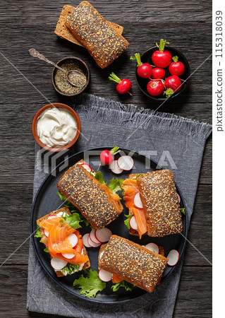 smoked salmon sandwiches on rye bread rolls 115318039