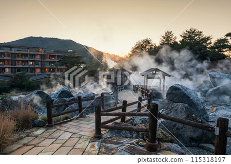 Mount Unzen Hell valley Jigoku and hotel with sulfur gas at sunset Mount Unzen Hell valley Jigoku and hotel with sulfur gas at sunset 115318197