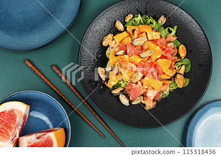 Salad with orange and mussels. Salad with orange and mussels. 115318436