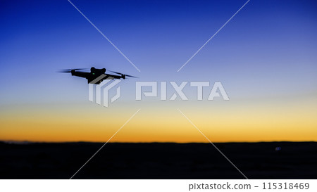 Drone flying in the sunset Drone flying in the sunset 115318469