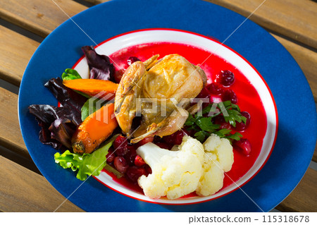 Grilled quail with sauce and vegetables 115318678