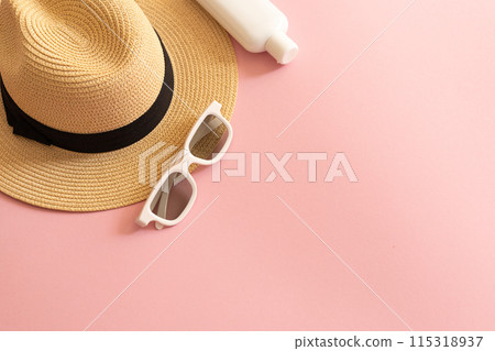 flat lay with straw hat, sunglasses and spf cream 115318937