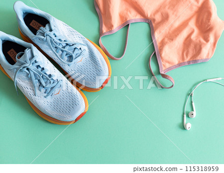 flat lay with sport wear, shoes and earphone flat lay with sport wear, shoes and earphone 115318959