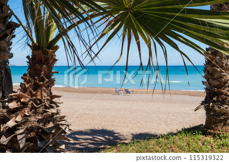 Two chairs on a sandy beach in Spain in spring. High quality photo 115319322