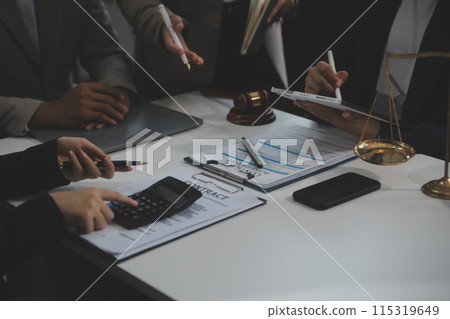 Judge gavel with Justice lawyers having team meeting at law firm background. Concepts of Law and Legal services. 115319649