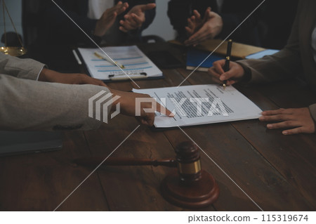 Judge gavel with Justice lawyers having team meeting at law firm background. Concepts of Law and Legal services. Judge gavel with Justice lawyers having team meeting at law firm background. Concepts of Law and Legal services. 115319674